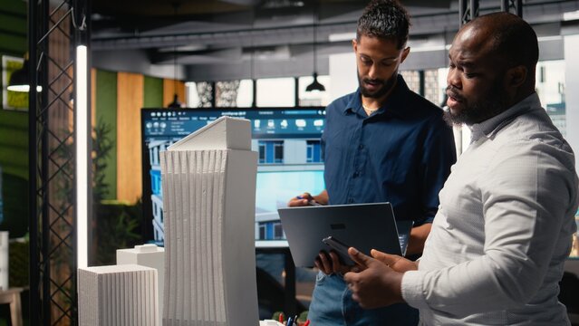 Contractors and property developers work together on a city planning initiative aimed at infrastructure and housing growth through investment and design. Architectural 3D models.