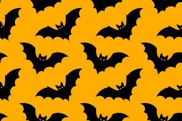 Seamless pattern with flying black bats on orange background. Perfect for Halloween spooky designs
