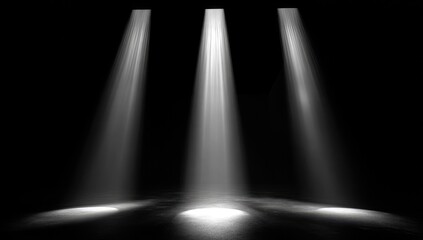 Three spotlight beams illuminating a dark stage (2)