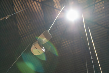 Industrial scene with telephone handset, large open space, high ceilings, sunlight streaming in,...
