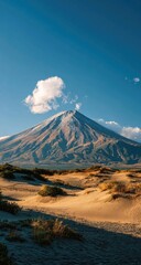 Fototapeta premium Volcanic peak above desert dunes