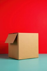 Obraz premium A plain brown cardboard box sits centered against a vibrant red backdrop , storage, surface, clean