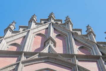 Obraz premium Old Roman Catholic church, Gothic architecture, arches, columns, earth tones, stone texture, natural lighting, overcast sky or sun low angle, monumental quality