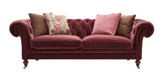Elegant, deep-rose velvet sofa with floral accent pillows