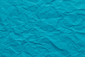 Ocean blue color crumpled paper texture, blank template wrinkly background with copy space