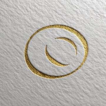 Gold embossed circle logo with two crescent shapes