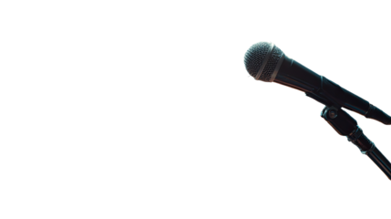 Close-up of a microphone against a black background