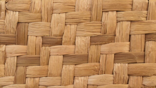 Tecido tran&ccedil;ado de fibra natural de palha seca, textura artesanal 