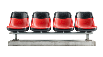 Four red stadium seats on a gray metal bench, mounted on a concrete base.  The seats are weathered, showing slight dirt and wear