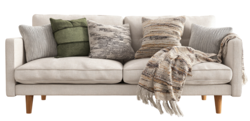 Light beige sofa with decorative pillows and a patterned throw blanket