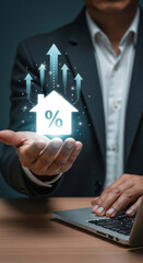 Businessman hand holding glowing house icon with percentage sign and upward arrows. Concept of real estate market growth, mortgage rates and property investment
