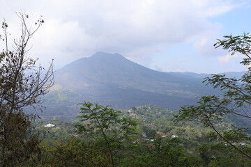 clouds above a large beautiful mountain