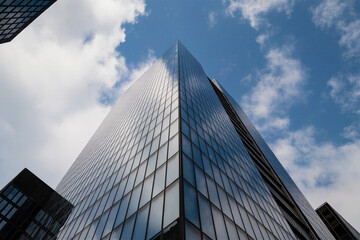 Modern Glass Skyscraper with Blue Sky Reflection