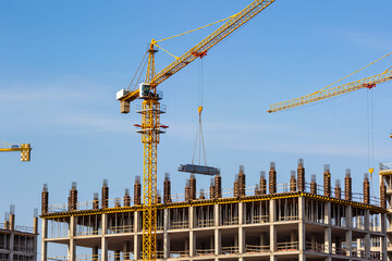 Tower Crane with Building Frame Under Blue Sky