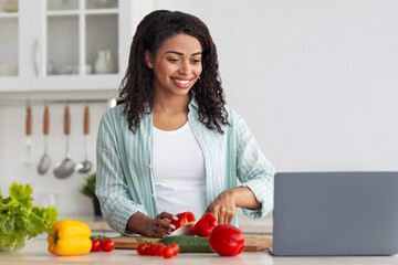 Online lesson, food class remotely, new normal and modern cooking. Smiling millennial african...