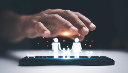Family insurance protection concept with digital icons of parents, child, health, home, car and finance on smartphone. Symbol of safety, care, security and future financial planning.
