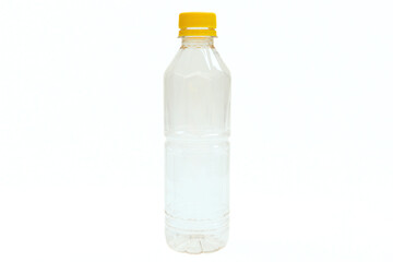 Empty plastic mineral water bottle on white background