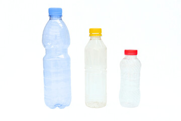 Empty plastic mineral water bottle on white background