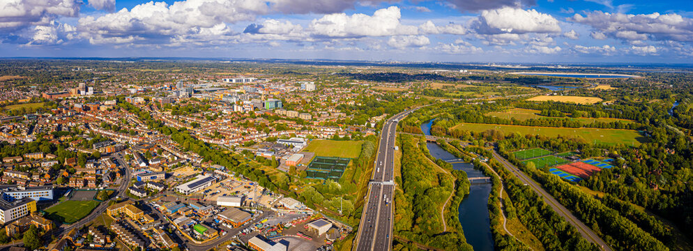 Aerial panoramic view of Slough town centre with modern buildings and green areas