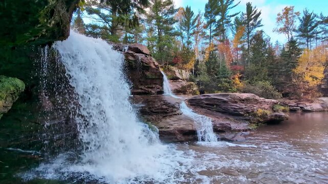 Rushing waters and autumn colors near O Kun De Kun Falls in the Ottawa National Forest of Michigan