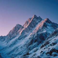 Majestic snow-capped mountain range at dawn