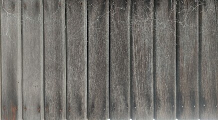 Fototapeta premium Old wooden plank wall with rustic texture and natural grain. Perfect for backgrounds, design templates, product mockups, and creative projects. Ideal for graphic designers, architects, decorators, and