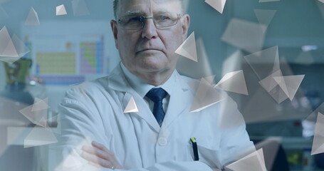 Standing scientist wearing lab coat crossing arms in lab, with periodic table and digital overlay