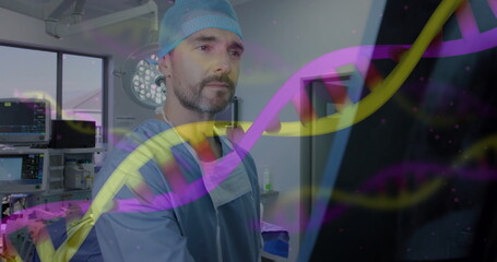 Male surgeon in blue scrubs studying genetic data on monitor in operating room, with DNA overlay