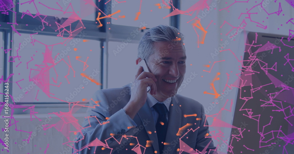 Poster talking man in suit viewing monitor and using smartphone at desk by window, with network graphics