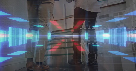 Inspecting cylindrical component, two engineers analyzing holographic data at modern lab workbench