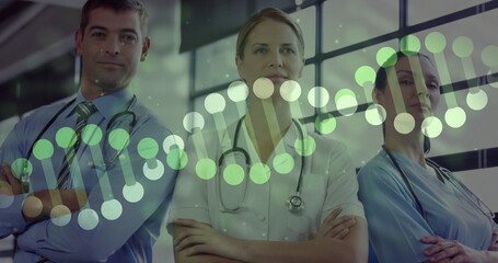 Standing three staff wearing scrubs and tie in medical lobby, with stethoscopes and DNA overlay