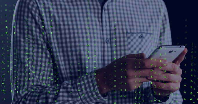 Holding smartphone, tech professional in checkered shirt scrolling data in studio, with binary code