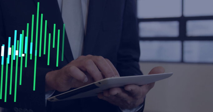 Mid adult business professional wearing dark suit tapping tablet in office, with data chart overlay