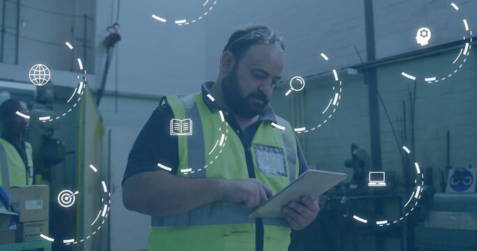 Monitoring Black man wearing safety vest using tablet in warehouse, with floating interface icons