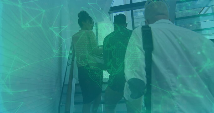 Ascending three professionals in suits scaling metal stairs at office building, with green overlay