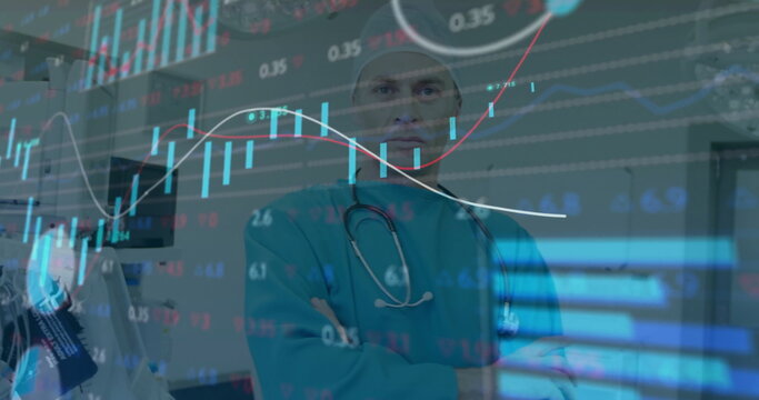 Gazing doctor wearing teal scrubs monitoring stock market chart overlay in hospital, stethoscope