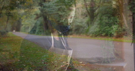 Leaning barista woman focusing on task inside cafe window, with light-colored apron and dark mask