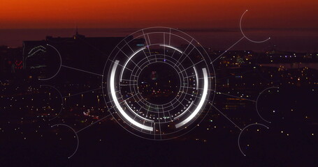 Obraz premium Displaying transparent HUD interface over city skyline at dusk, with glowing rings and data markers