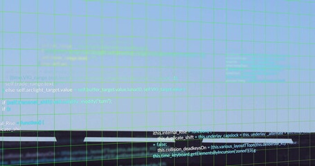 Displaying source code blocks scrolling on screen in dark office, with green grid overlay