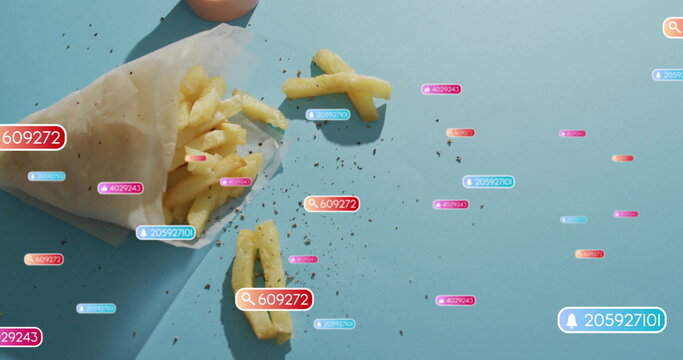 Presenting white parchment cone holding pepper-flecked fries on blue table, UI badges, copy space