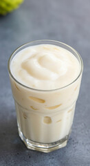 Tasty coconut milkshake. Tropical fruit juice or smoothie. Creamy tropical drink. Healthy food concept
