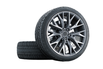 Two tires stacked, showing alloy wheel.  Close-up of a modern, dark gray alloy wheel with a complex, spoke design.  A second, standard tire rests beneath