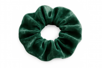 Verdant velvet scrunchie floating against transparent backdrop, embodying chic hair styling elegance