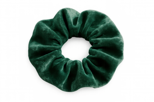 Verdant velvet scrunchie floating against transparent backdrop, embodying chic hair styling elegance