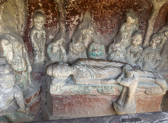 Sculpture of Sakyamuni Buddha in Nirvana in Grotto 495 at Thousand-Buddha Cliff along bank of Jialing River in Guangyuan, Sichuan, China, constructed from late Northern Wei Dynasty.