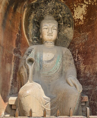 Big Buddha statue in Shenlong Grotto at Thousand-Buddha Cliff along bank of Jialing River in Guangyuan, Sichuan, China, constructed from late Northern Wei Dynasty.
