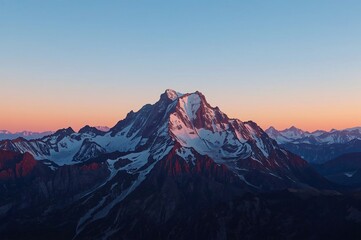Fototapeta premium Sunrise over snow-capped mountain range, alps