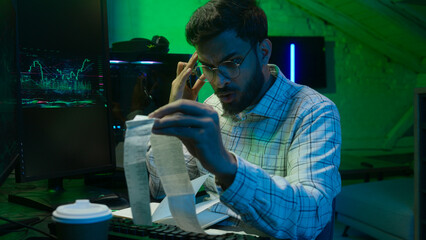 Arabian Indian man male guy programmer examining writing binary code coder freelancer engineer...