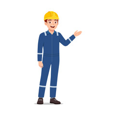 Happy young caucasian construction worker presenting something in blue uniform and yellow helmet