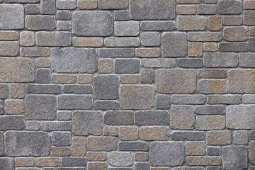 Rustic stone wall featuring a rubble masonry style and a random height pattern adding to the organic and varied aesthetic